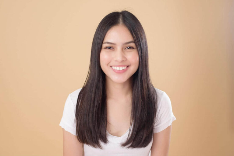 woman wondering how long do dental implants last